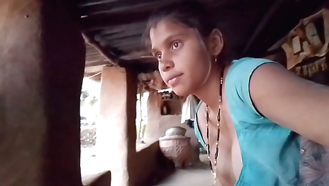 Indian girl is playing with her shaved pussy at her house