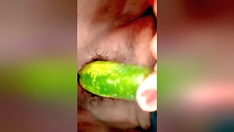 Indian housewife eats cucumber to have fun with herself
