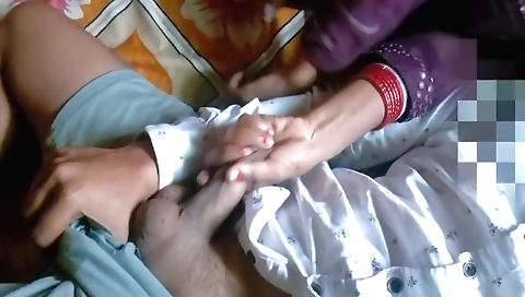 Indian girl with a nice ass gives a hand job to her man