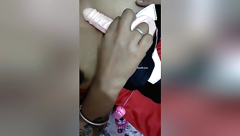 Busty solo girl with a big ass has fun with a dildo