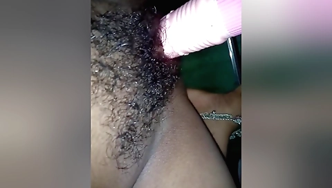 Hairy indian solo female enjoys playing with a toy