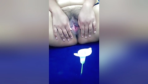 Indian girl with hairy pussy moans as she masturbates