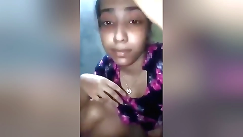 Indian woman in a swimsuit and in a sexy pose in the bathroom
