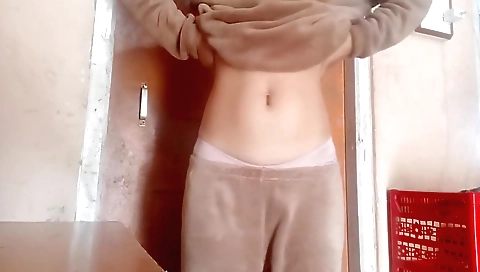 Pretty girl with small tits and long hair hides behind a desk