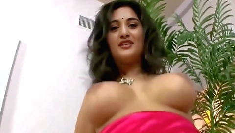 Indian brunette showing her big tits and ass in the video