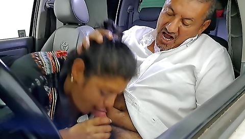 Indian brunette giving a face to a guy in a hot car