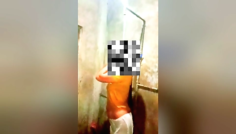 Indian girl in a red dress shows her natural body in the shower