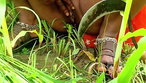 Indian girl is making love to herself in the field