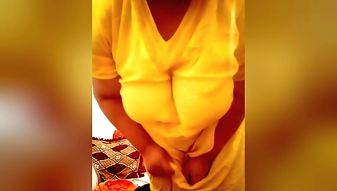 Indian girl with big tits is wearing sexy outfit and a dress